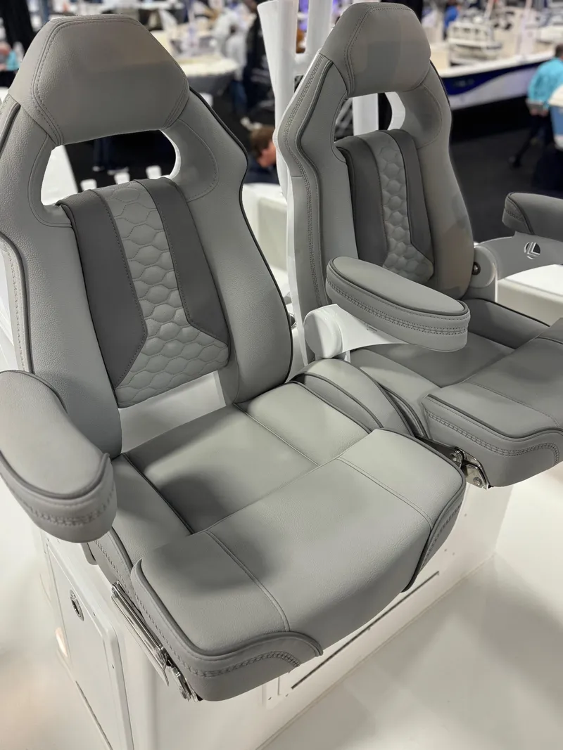Slide: The Image of Luxury seating on 2025 Cape Horn 28 XS boat, featuring plush gray upholstery and ergonomic design. - 16