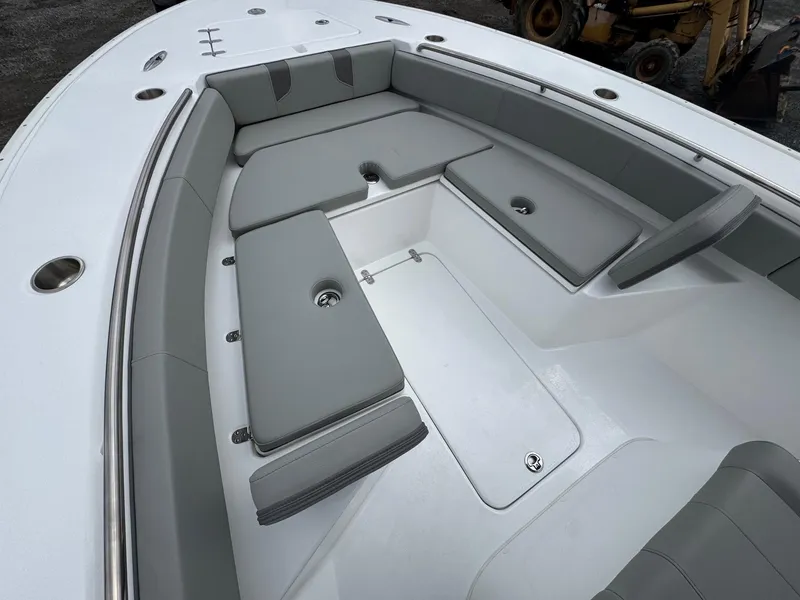 Slide: The Image of 2025 Cape Horn 28 XS boat interior with gray cushioned seating. - 24