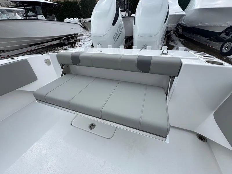 Slide: The Image of 2025 Cape Horn 28 XS boat with gray seating and dual outboard engines. - 27