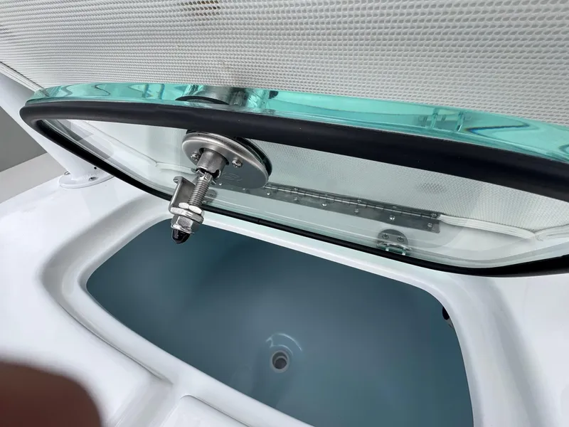 Slide: The Image of Open hatch of 2025 Cape Horn 28 XS boat, showcasing interior compartment. - 30