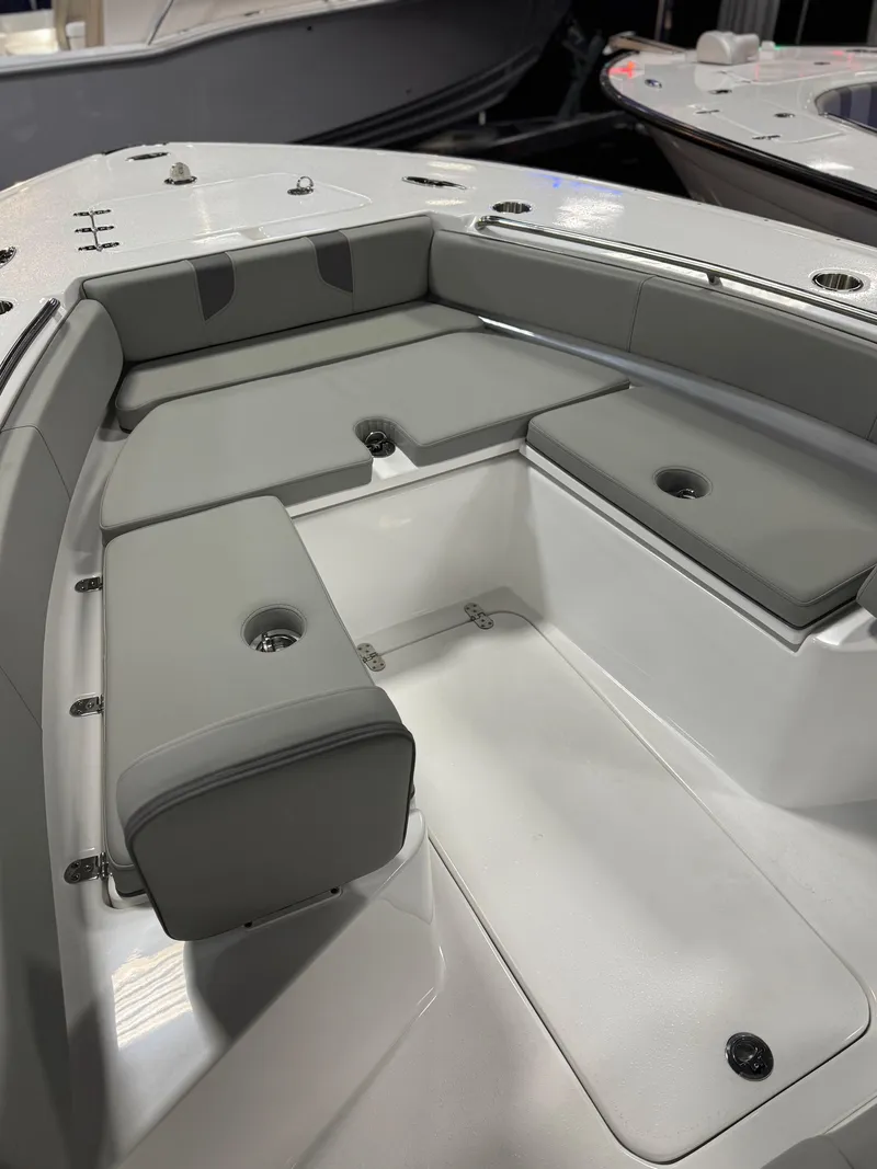 Slide: The Image of 2025 Cape Horn 28 XS boat interior with gray cushioned seating. - 39
