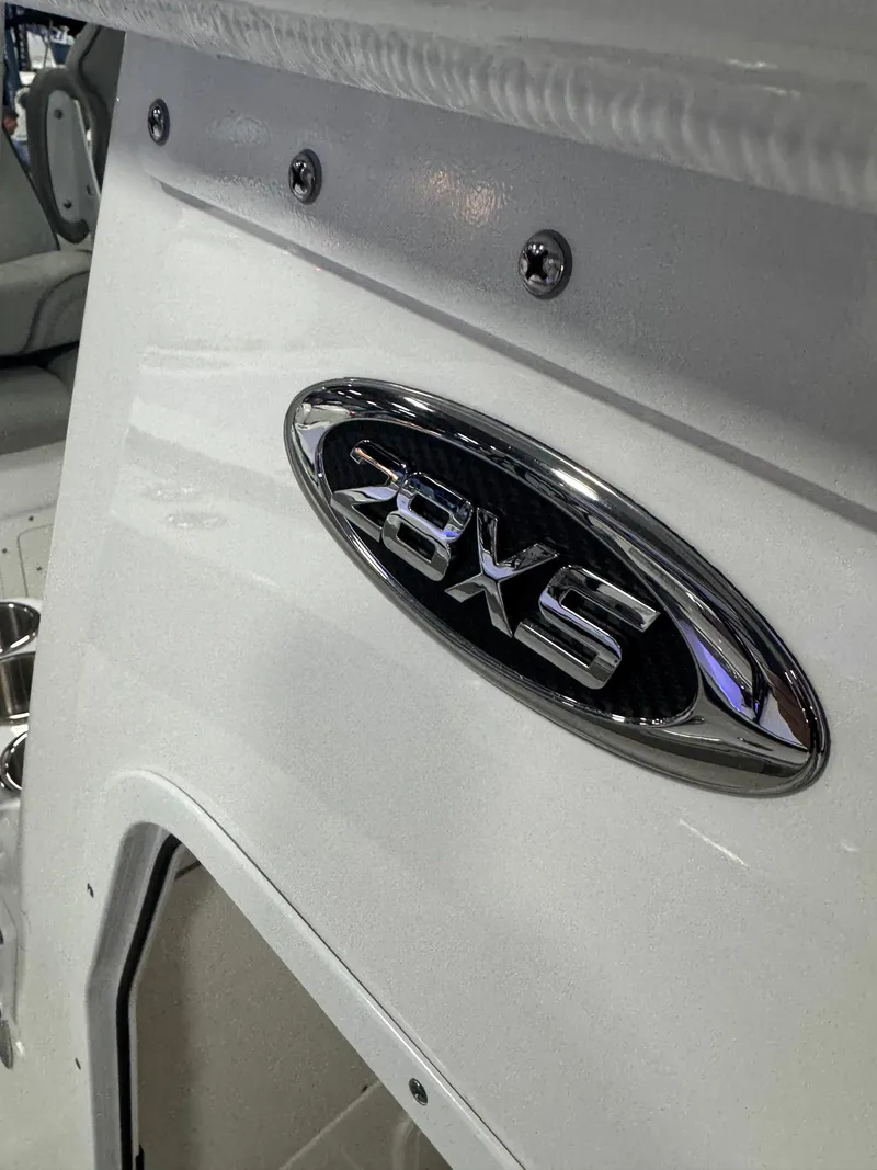 Slide: The Image of 2025 Cape Horn 28 XS boat emblem on white surface. - 41