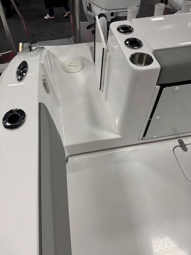 Slide: The Image of 2025 Cape Horn 28 XS boat interior with cup holders and storage compartments. - 47