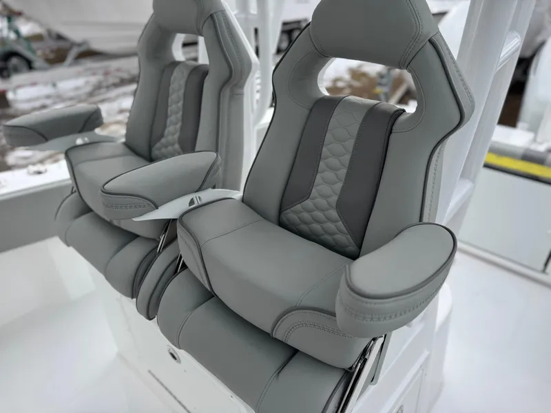 Slide: The Image of Luxury seating on 2025 Cape Horn 28 XS boat, featuring sleek gray upholstery. - 5