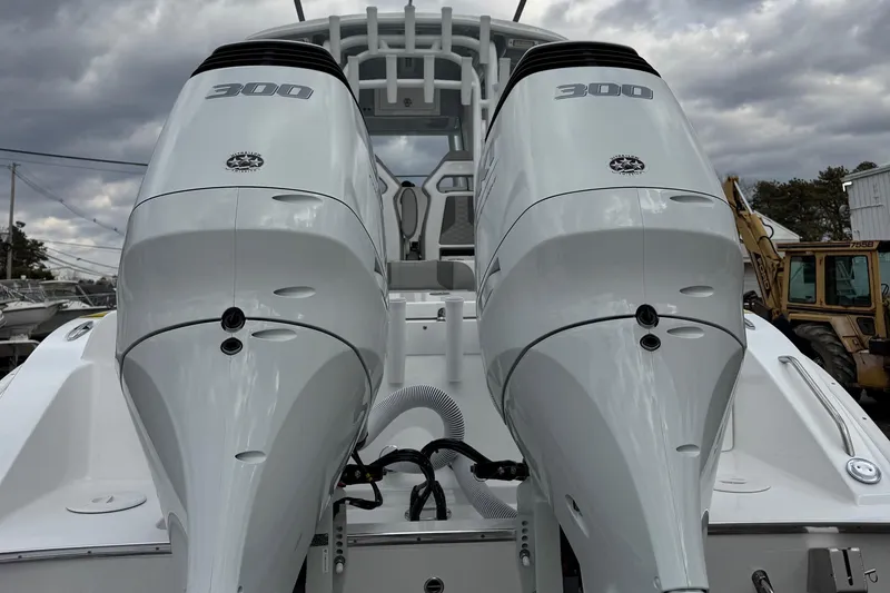 Slide: The Image of 2025 Cape Horn 28 XS boat with dual 300 horsepower engines, rear view. - 7