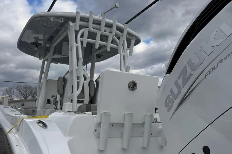 Slide: The Image of 2025 Cape Horn 28 XS boat with Suzuki engine under cloudy sky. - 8