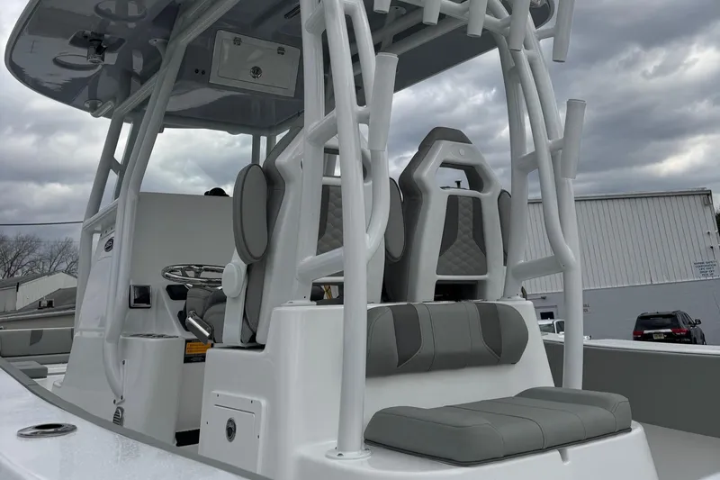 Slide: The Image of 2025 Cape Horn 28 XS boat interior with modern seating and control console. - 9