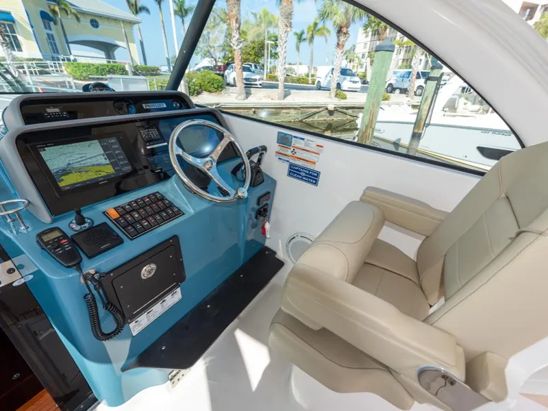 Slide: The Image of 2018 Pursuit OS 385 Offshore helm with navigation system and comfortable captain's chair. - 29