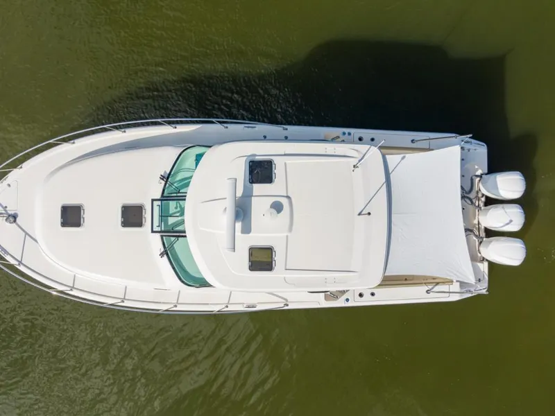 Slide: The Image of 2018 Pursuit OS 385 Offshore boat, aerial view, on calm water. - 5