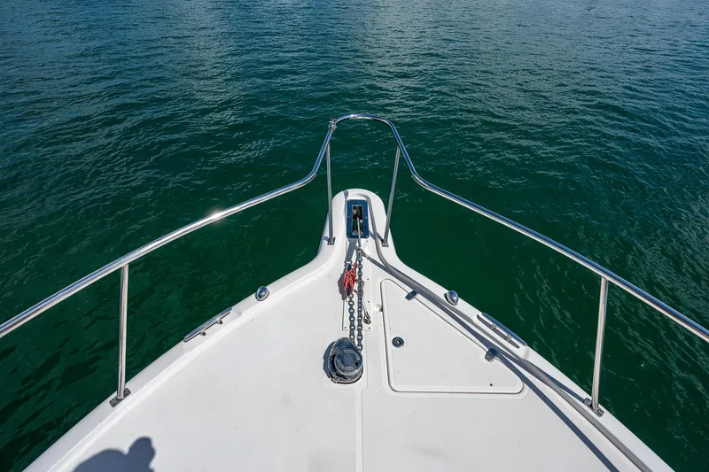 Slide: The Image of Bow view of 2018 Pursuit OS 385 Offshore boat on water. - 9