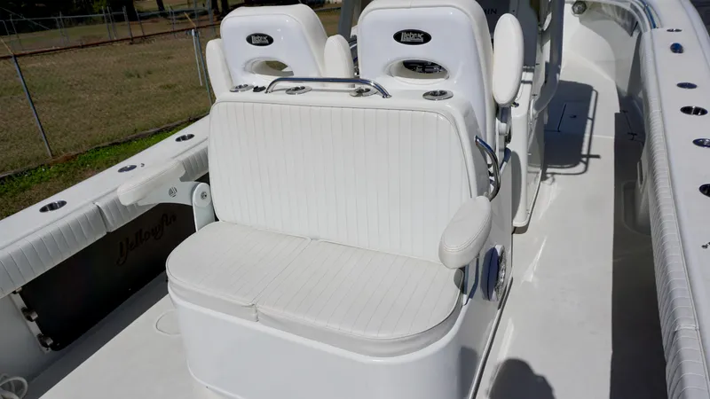 Slide: The Image of 2006 Yellowfin 34 Offshore boat interior with white seating and console. - 17