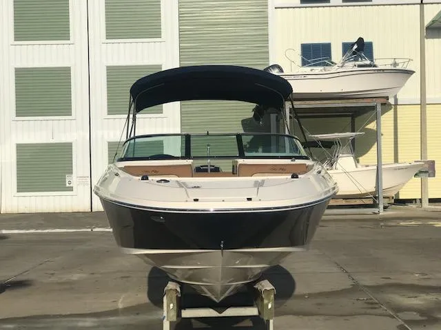 Slide: The Image of 2015 Sea Ray 220 Sundeck Outboard boat in storage facility. - 4