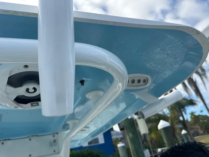 Slide: The Image of Close-up of 2018 Sea Hunt 25 Gamefish boat's blue canopy and speaker system. - 17