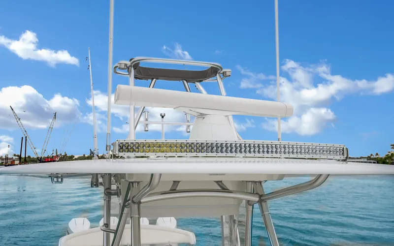 Slide: The Image of 2017 Bahama Center Console boat on water with clear blue sky background. - 21