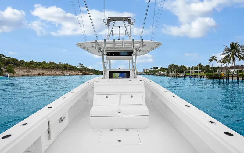 Slide: The Image of 2017 Bahama Center Console boat on clear blue water, tropical background. - 22