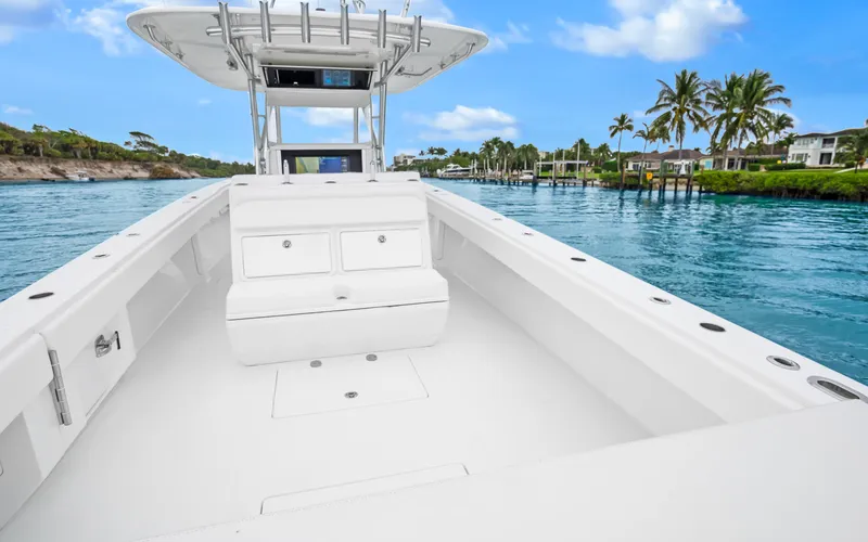 Slide: The Image of 2017 Bahama Center Console boat on tranquil water with palm trees in the background. - 23