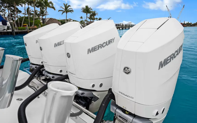 Slide: The Image of 2017 Bahama Center Console with four Mercury outboard engines on turquoise water. - 32