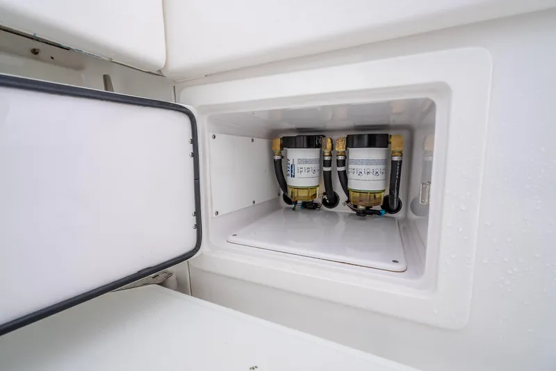 Slide: The Image of 2017 Bahama Center Console boat fuel filter compartment. - 34