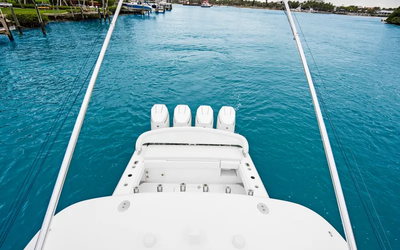 Slide: The Image of 2017 Bahama Center Console boat with four engines on blue water. - 38