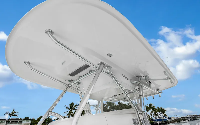 Slide: The Image of 2017 Bahama Center Console boat with T-top against blue sky background. - 39