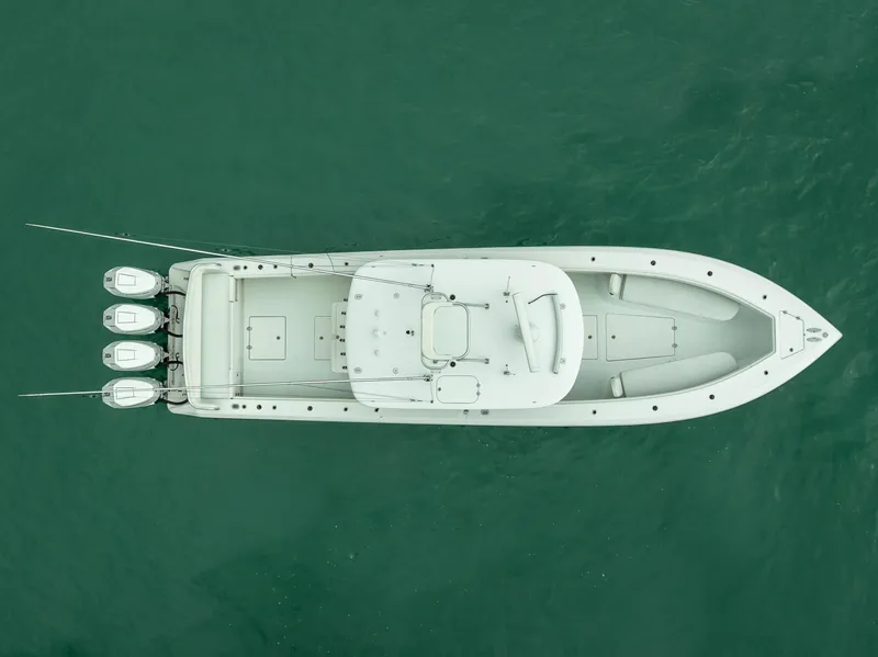 Slide: The Image of 2017 Bahama Center Console boat, aerial view, on green water. - 4
