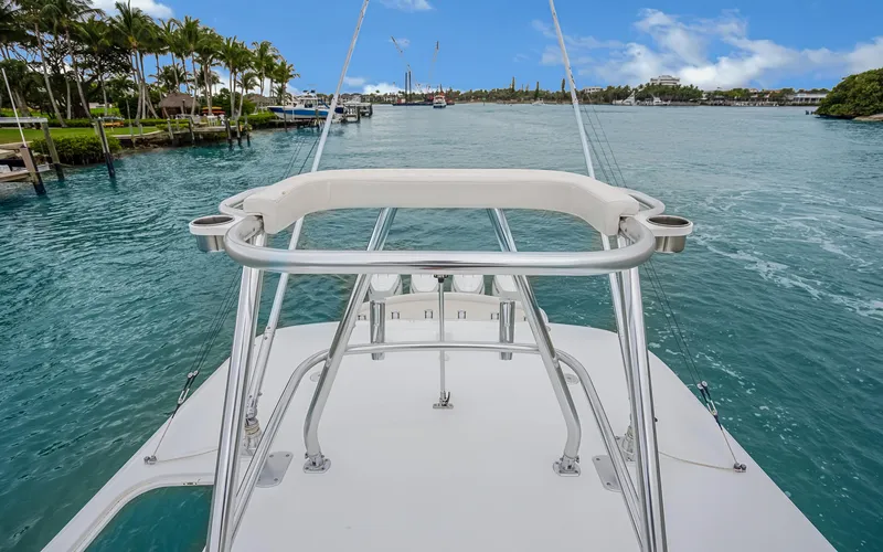Slide: The Image of 2017 Bahama Center Console boat navigating scenic waterway with palm trees. - 40