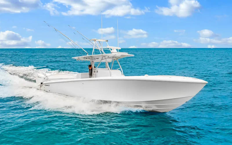 Slide: The Image of 2017 Bahama Center Console boat cruising on open ocean under blue sky. - 42