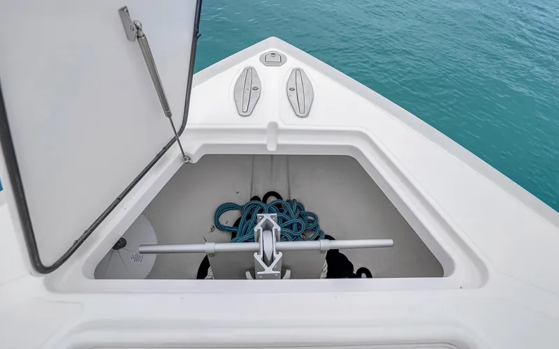 Slide: The Image of Open anchor storage on 2017 Bahama Center Console boat with ropes and anchor. - 5