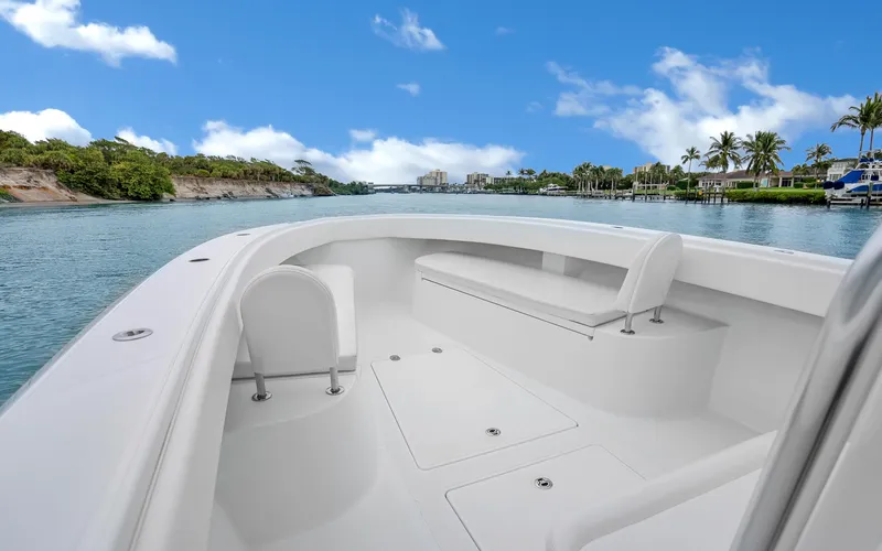 Slide: The Image of 2017 Bahama Center Console boat on scenic waterway with clear blue sky. - 6