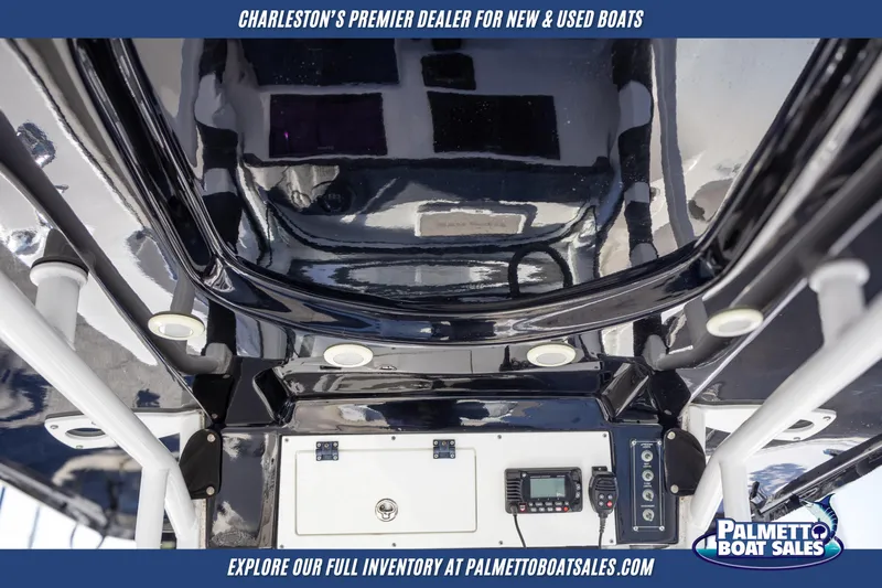 Slide: The Image of 2022 Sea Pro 259 Center Console boat interior with control panel and storage. - 11