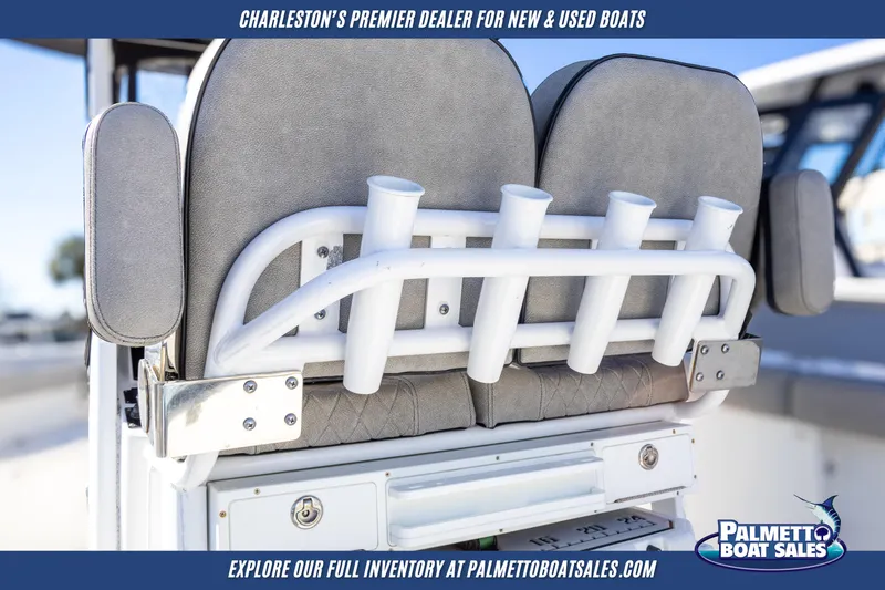 Slide: The Image of 2022 Sea Pro 259 Center Console boat seating with rod holders, showcased by Palmetto Boat Sales. - 13