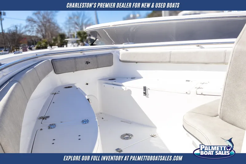 Slide: The Image of 2022 Sea Pro 259 Center Console boat interior with seating, showcased by Palmetto Boat Sales. - 16