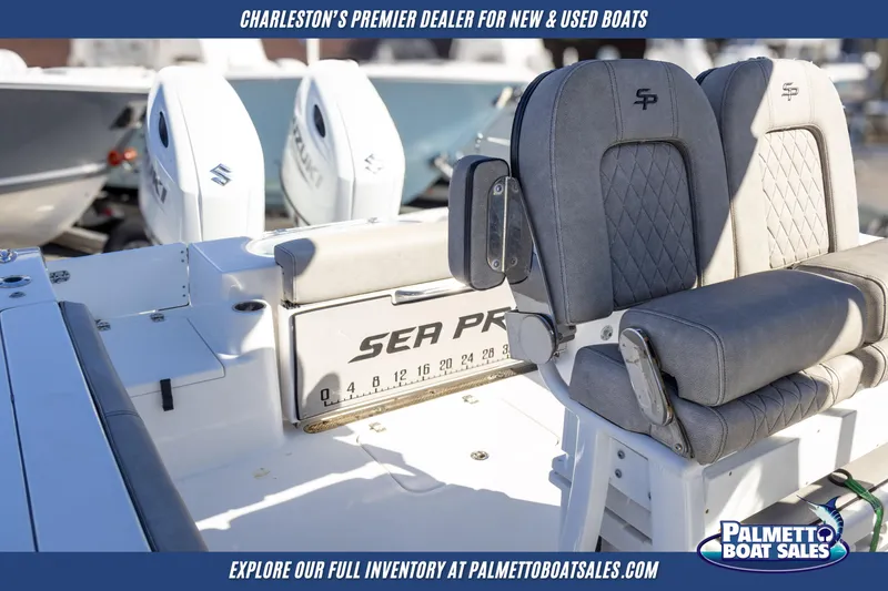 Slide: The Image of 2022 Sea Pro 259 Center Console boat interior with dual engines, showcased by Palmetto Boat Sales. - 18