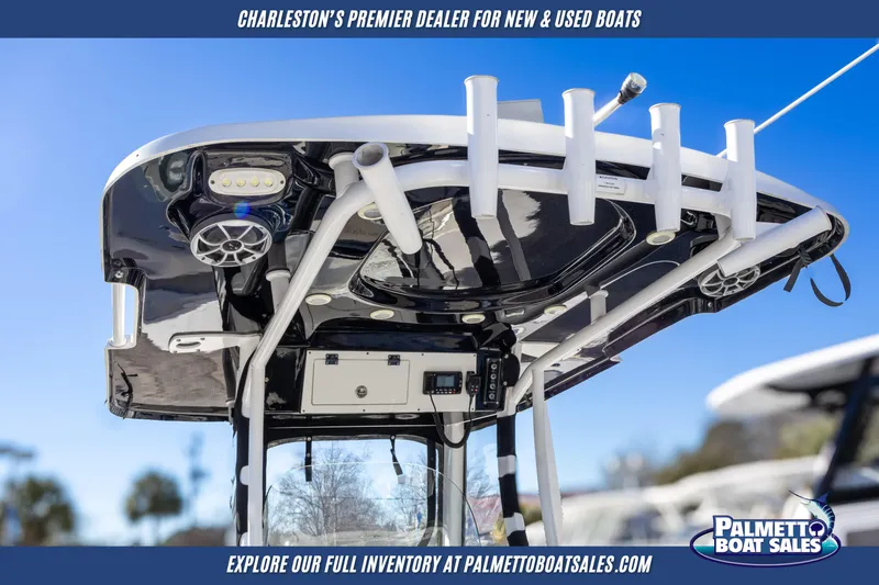 Slide: The Image of 2022 Sea Pro 259 Center Console boat top view with rod holders and electronics. - 8