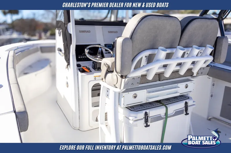 Slide: The Image of 2022 Sea Pro 259 Center Console boat interior with helm and seating, showcased by Palmetto Boat Sales. - 9
