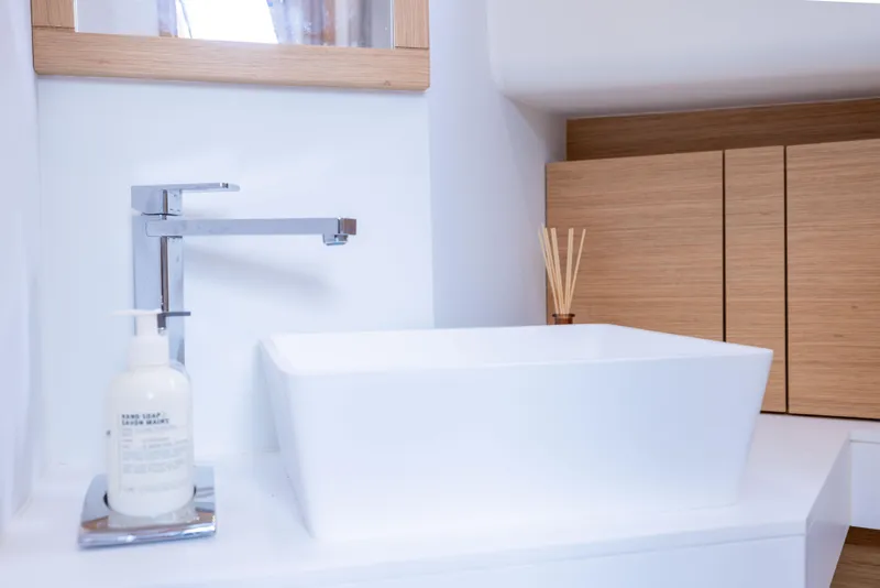 Slide: The Image of Modern bathroom sink on 2021 Pardo Yachts 43, featuring sleek faucet and wooden cabinetry. - 39
