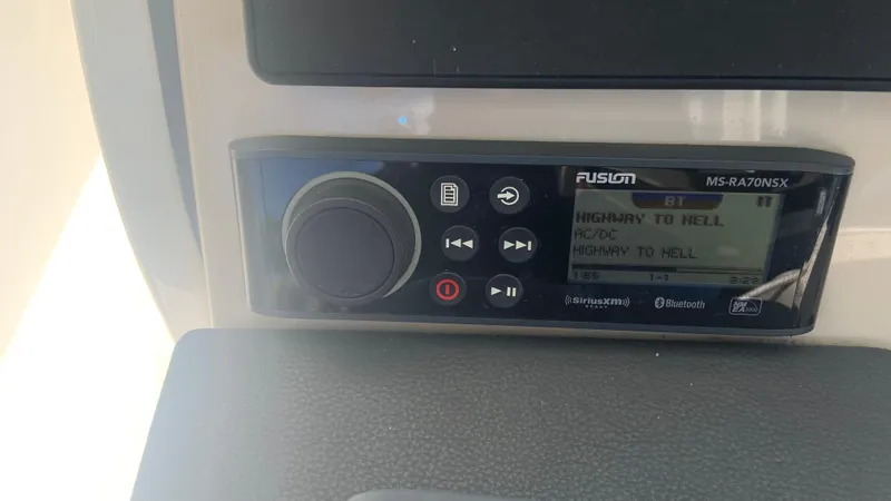 Slide: The Image of Fusion MS-RA70NSX stereo on 2019 Boston Whaler 320 Vantage, playing "Highway to Hell". - 19