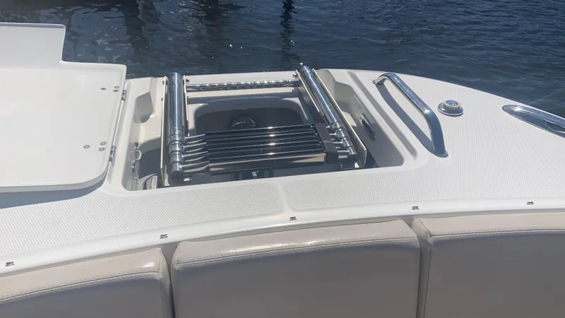 Slide: The Image of 2019 Boston Whaler 320 Vantage boat with a retractable swim ladder. - 9