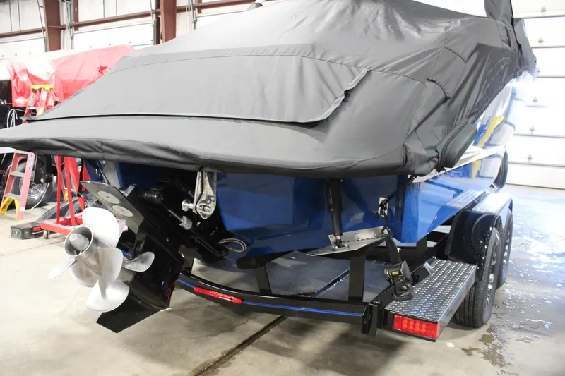 Slide: The Image of 2025 Cobalt R6 boat on trailer, covered, in indoor storage facility. - 13