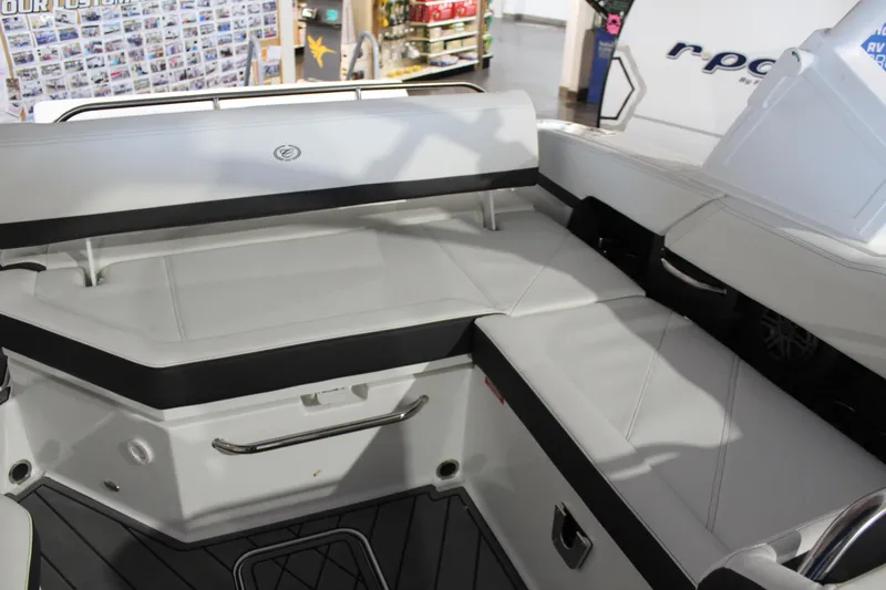 Slide: The Image of 2025 Cobalt R6 boat interior with white seating and black accents. - 19