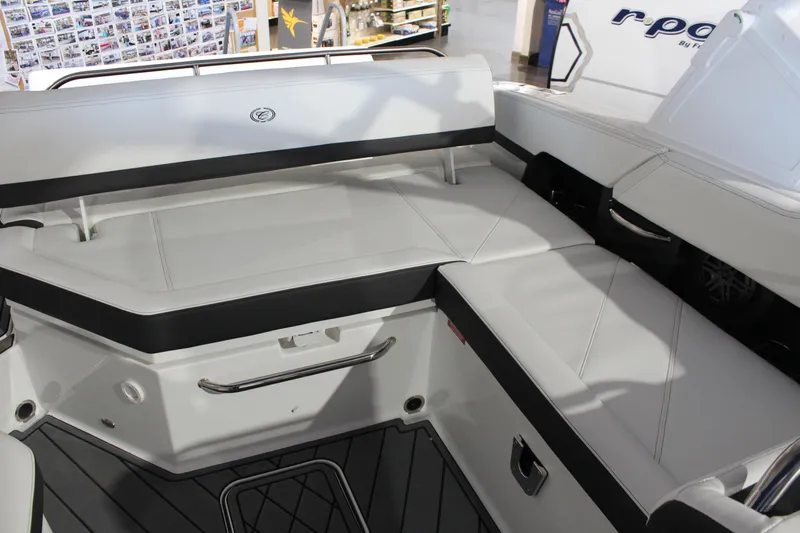 Slide: The Image of 2025 Cobalt R6 boat interior with white seating and black accents. - 20