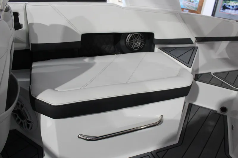 Slide: The Image of 2025 Cobalt R6 boat interior with sleek white seating and modern design elements. - 21