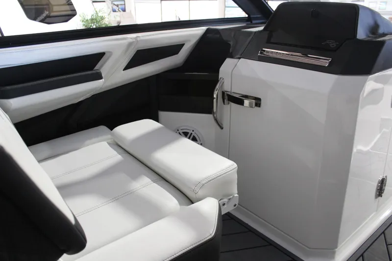 Slide: The Image of Interior of 2025 Cobalt R6 boat with sleek white seating and modern design. - 29
