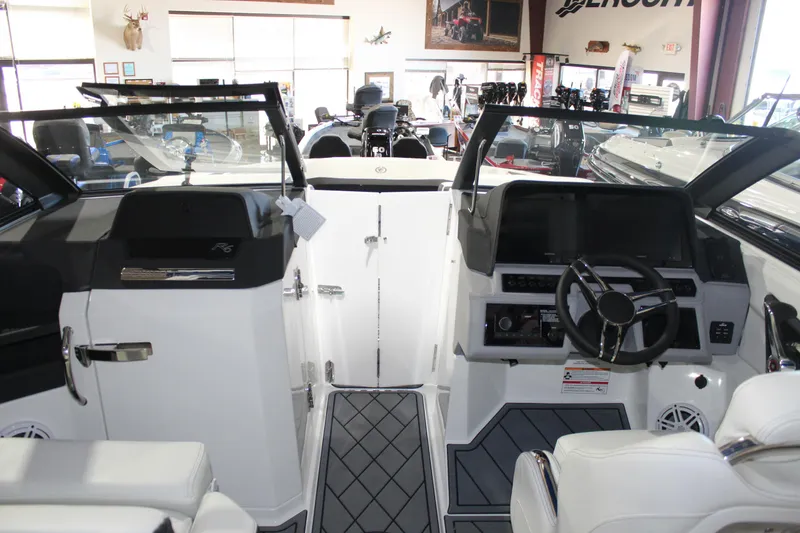 Slide: The Image of Interior view of 2025 Cobalt R6 boat, featuring modern dashboard and seating. - 30