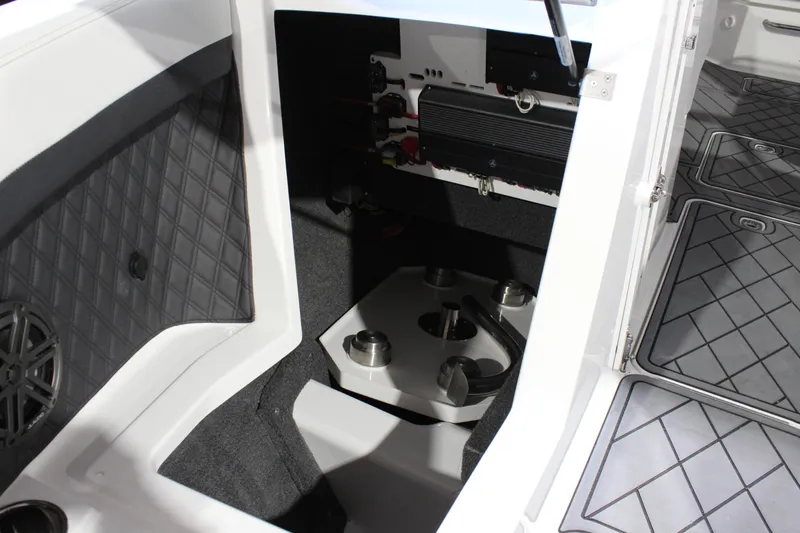Slide: The Image of Interior view of 2025 Cobalt R6 boat, showcasing storage compartment and seating area. - 38