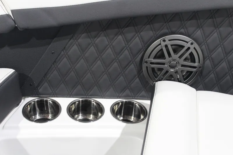 Slide: The Image of 2025 Cobalt R6 interior with cup holders and speaker, featuring quilted upholstery. - 39