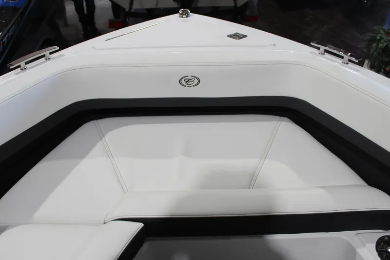Slide: The Image of 2025 Cobalt R6 boat interior with white seating and sleek design. - 43