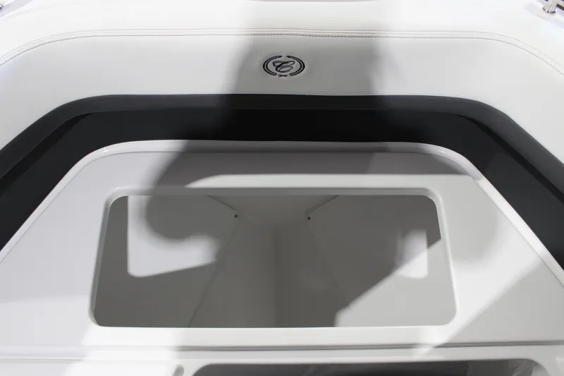 Slide: The Image of 2025 Cobalt R6 boat interior storage compartment with sleek design and logo. - 44