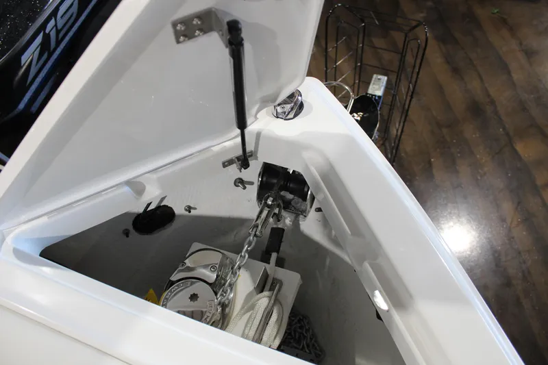 Slide: The Image of Anchor compartment of 2025 Cobalt R6 boat with chain and winch. - 46