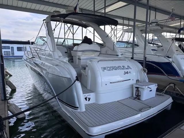 Slide: The Image of 2006 Formula 34 PC yacht docked in a marina, rear view. - 14